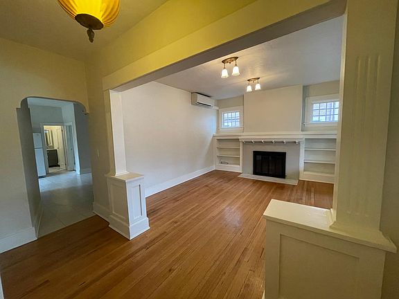 Living room, original hard woods, working fireplace