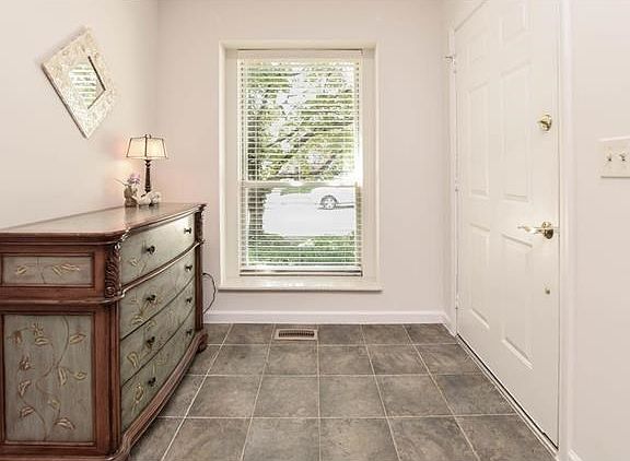 The ceramic tiled foyer greats your guests with charm.