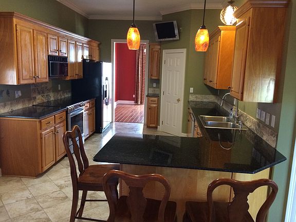 Open kitchen with bar seating