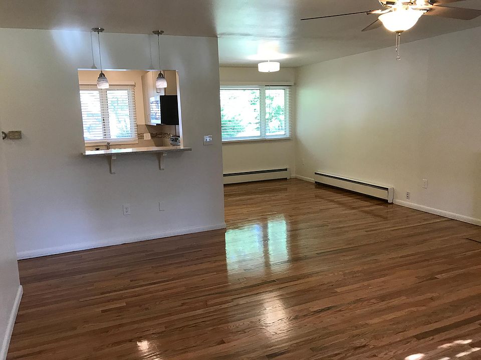 Living room looking toward kitchen and dining. Gorgeous hard