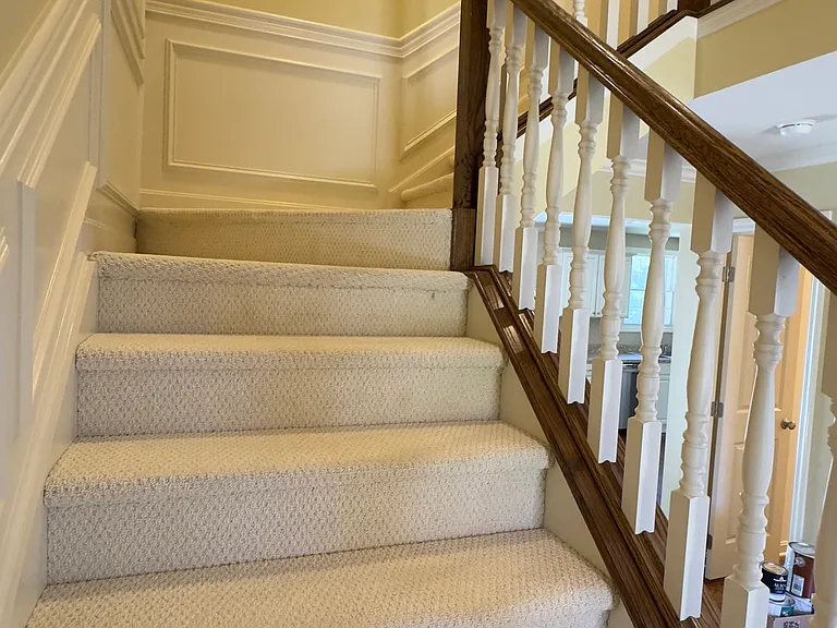 Beautiful staircase featuring elegant molding to the third floor bedrooms.
