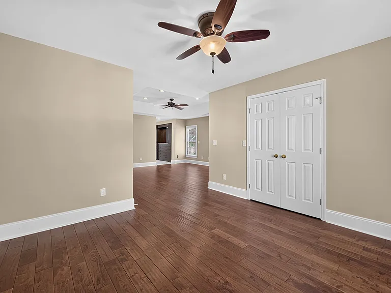 master bedroom with sitting room - hardwood floors