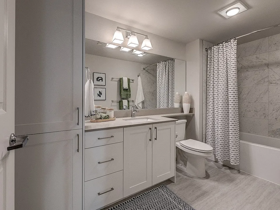 Our beautiful bathrooms have inset sinks on quartz countertops, and ample storage including a linen closet.