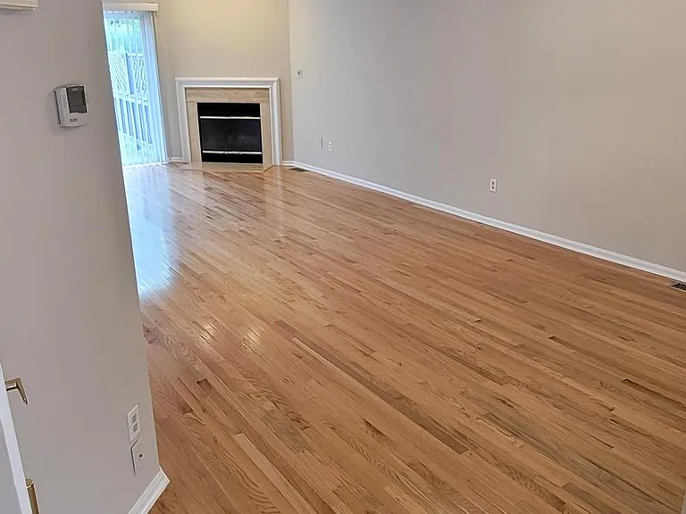 entrance to living area from foyer, basement door on left