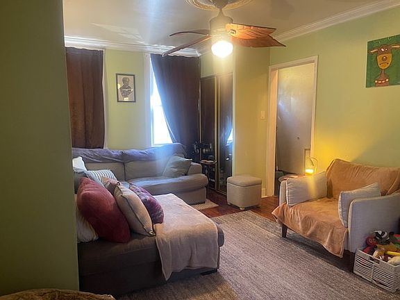 Enter front door to the Living Room & turn back to see the front windows & door entry hall