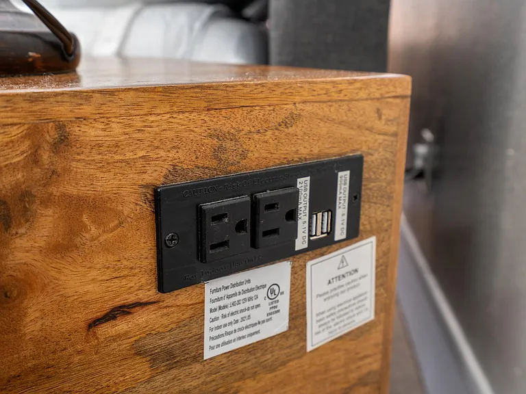charging station on back of nightstands in master