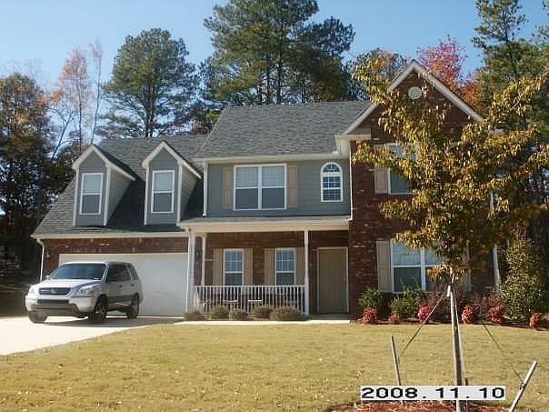 The first photo of our home when we purchased it in 2008. We have remodeled the home since. Both inside and outside changes.