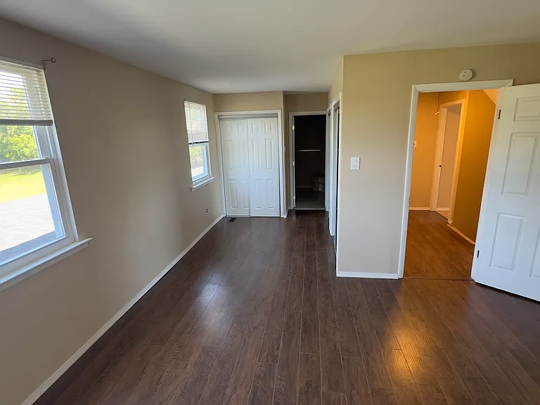 Master bedroom with two large closets and a full bathroom.