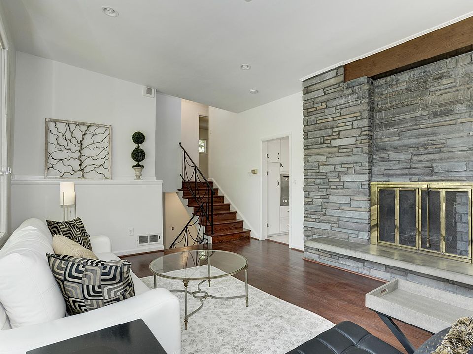 Living room with wood burning fireplace