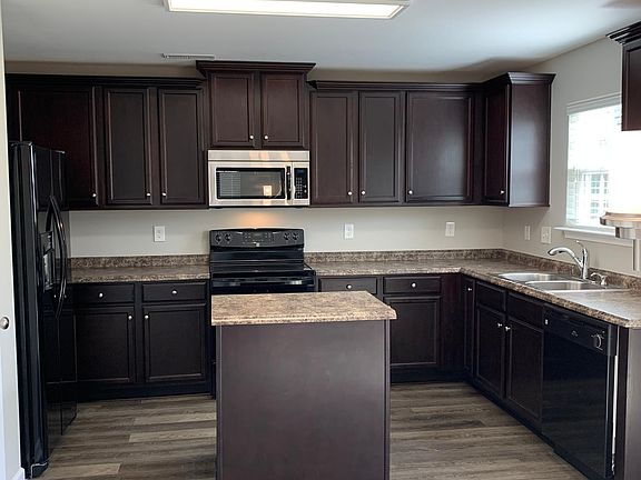 Amazing kitchen with island for extra storage and counter space.