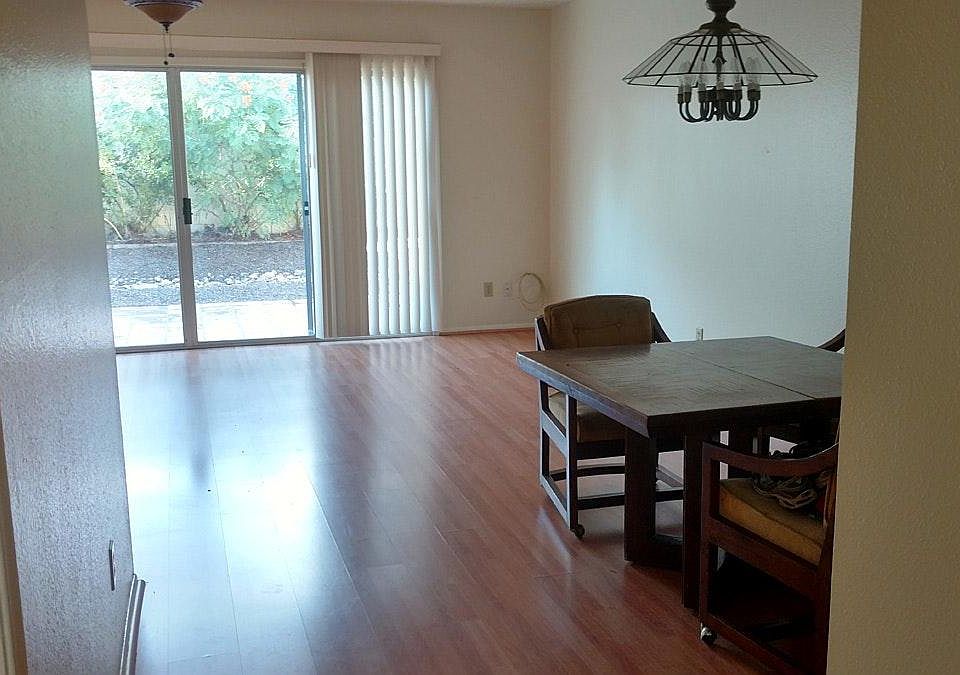 Main living area with wood floors and dining area