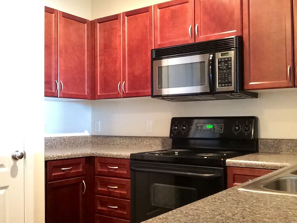 Kitchen with pantry and black appliances