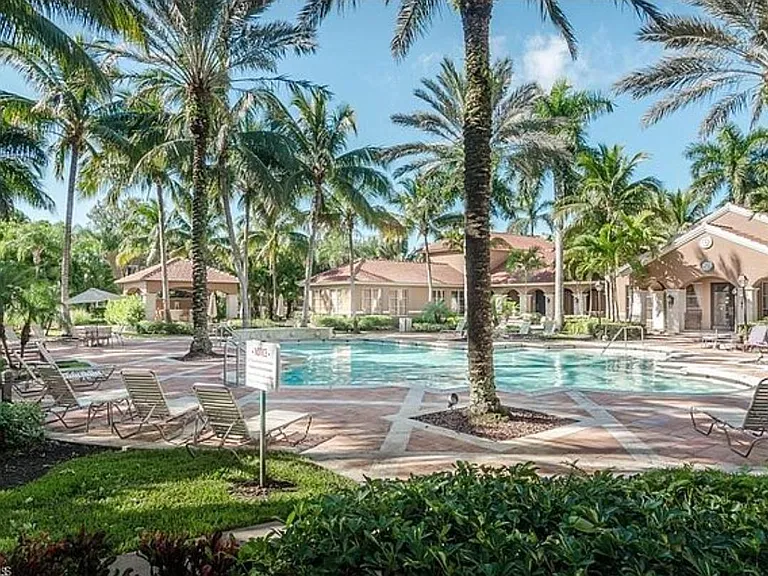 Beautiful heated pool, charcoal grills, and club house just few steps away from apartments. Right next to the building.