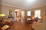 Gorgeous Formal Living Room welcomes you and french doors to family rm