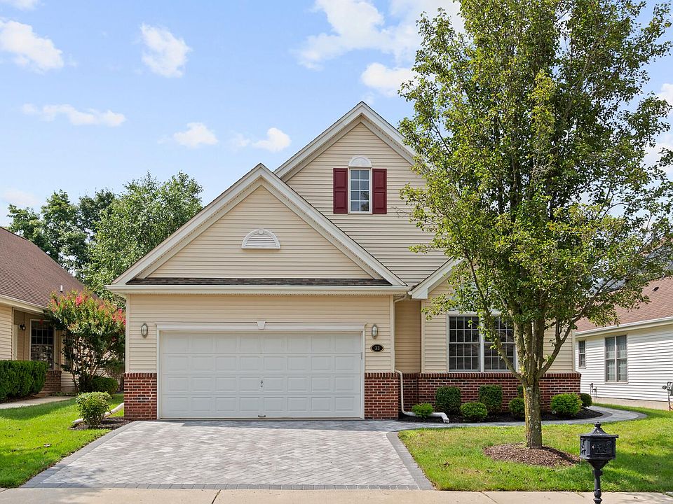 Curb appeal, paver driveway, two car garage