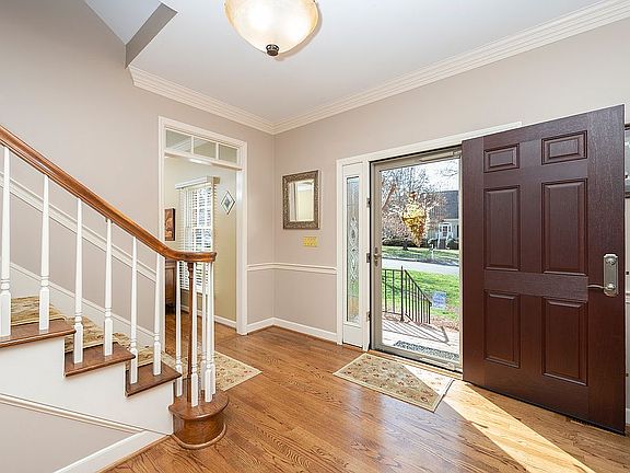 Wide entryway with hardwoods