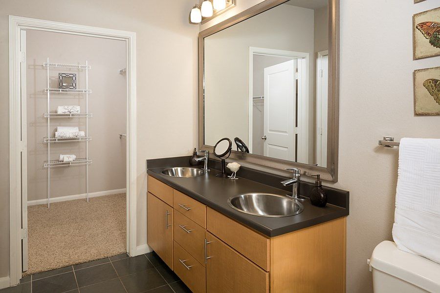 European-inspired bathrooms with oval soaking tubs and double vanities