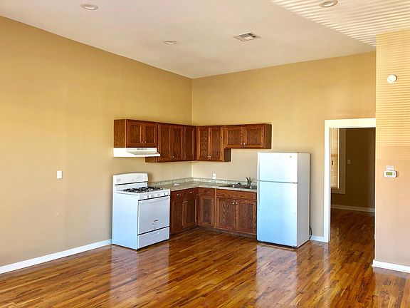 Kitchen with full size range and fridge