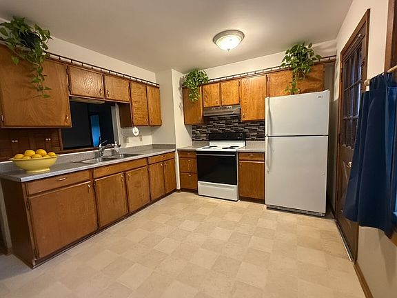 Large Partially Open Concept Kitchen with plenty of storage and counter space.