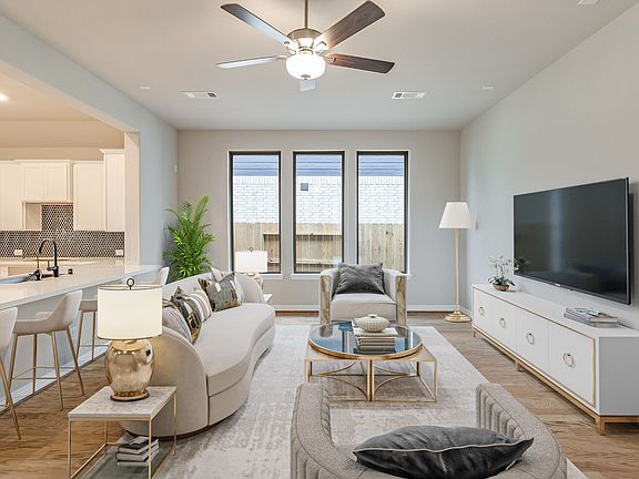 Gather the family and guests together in your lovely family room Featuring high ceilings, neutral