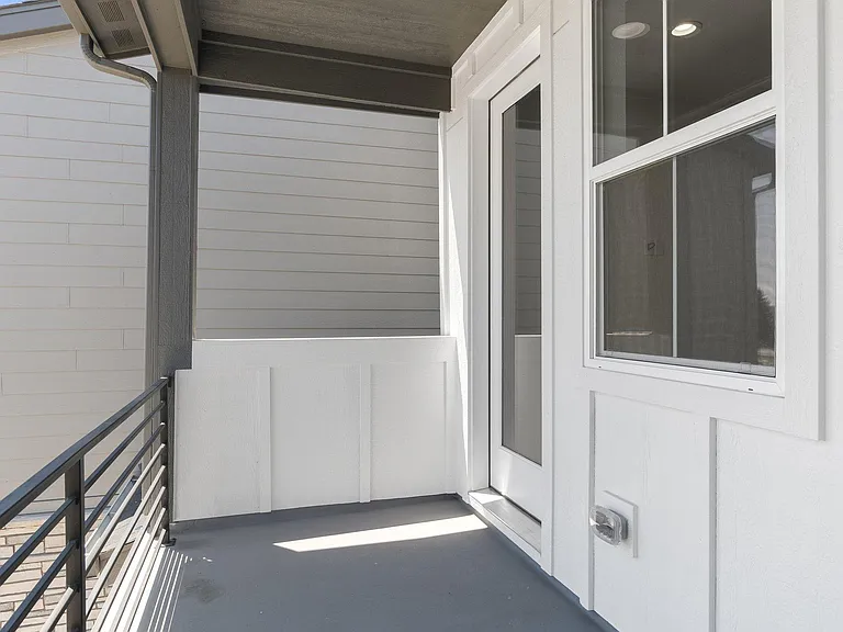 Oversized Patio with Door leading into Open Concept Living/Dining & Kitchen area