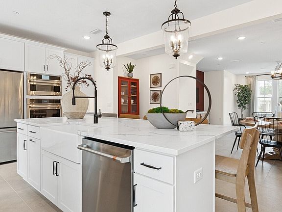 Kitchen with white apron front sink