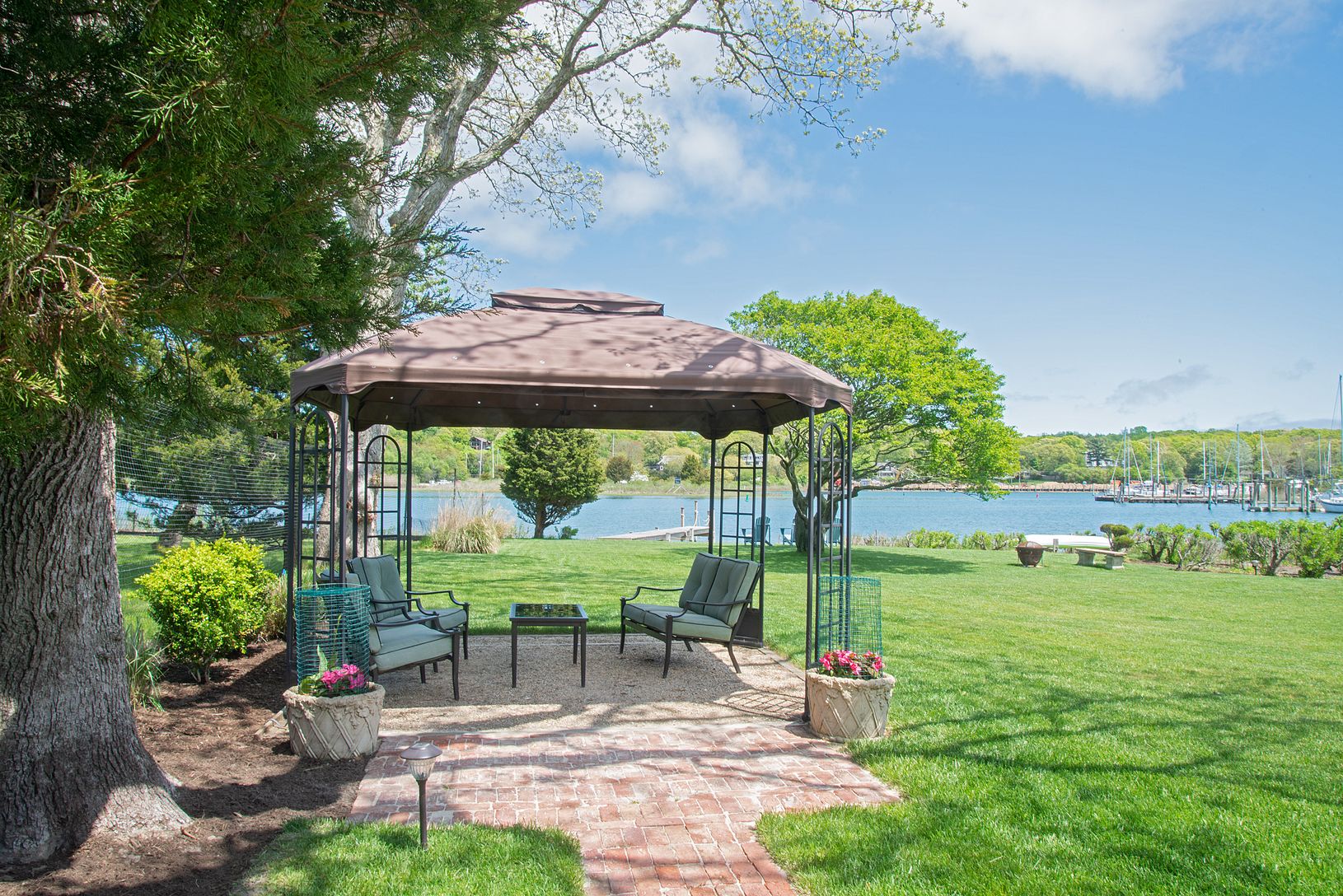 Enjoy cool summer breezes in the gazebo under the shade of two great oak trees.