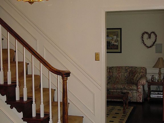 Large center hall entry with hardwood, flanked by living and dining rooms.