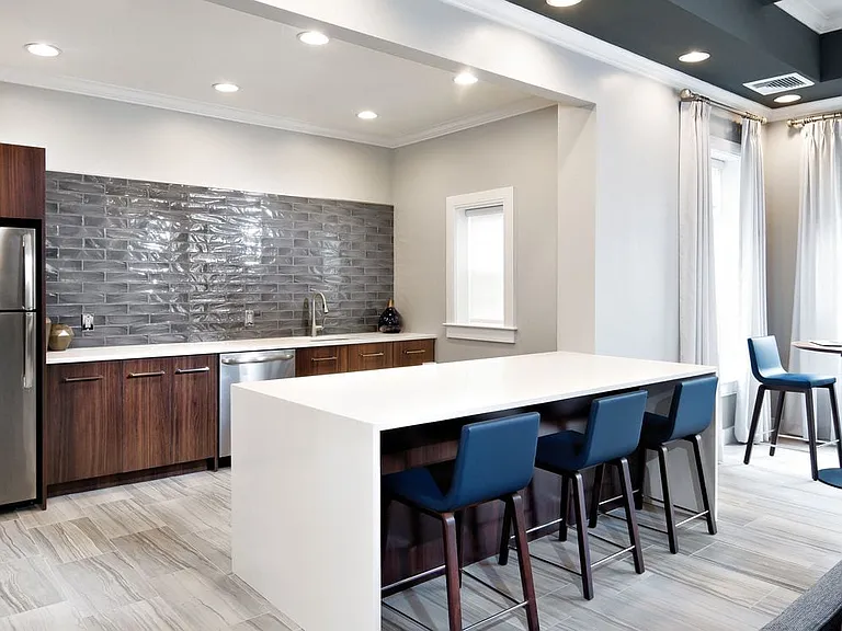 Resident lounge with kitchenette and lounge seating