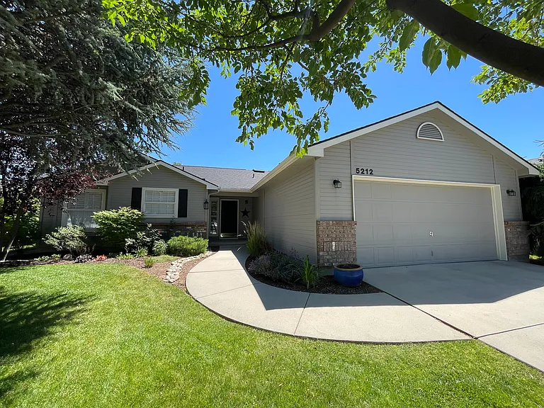 Mature landscaping and walking path to front door