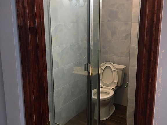 Brand new Bathroom with Tile WAlls