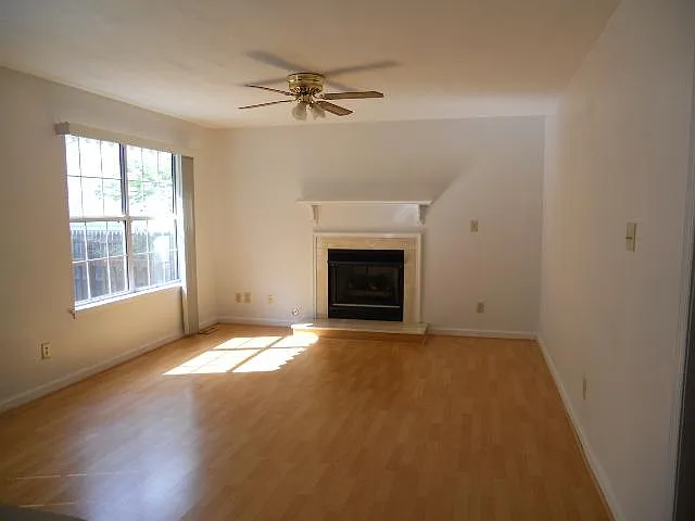 OLDER PHOTO OF FAMILY ROOM - UPDATED PAINT AND FLOORING