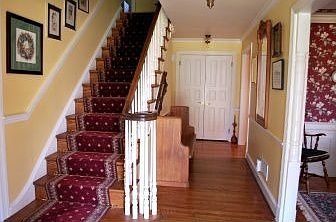 Center hall foyer is flanked by living & dining rm