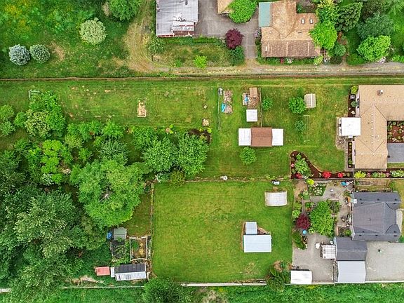Another great view showing all the handy outbuildings. There is so much space for outdoor fun, gardening or just relaxing and enjoying your private oasis!