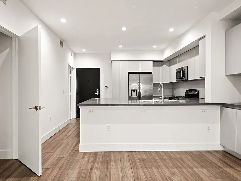 Open-Concept Kitchen and Hall Storage Closet