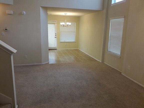 Living room with view to dining area.