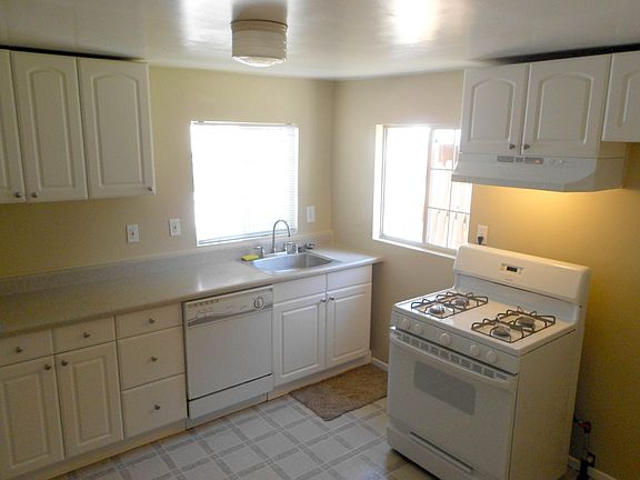 The kitchen has a gas stove, a dishwasher and a garbage disposal.