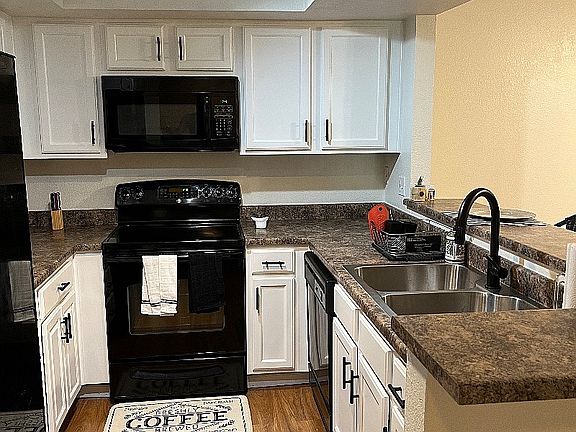 Kitchen Area includes refrigerator, oven, dishwasher and microwave.