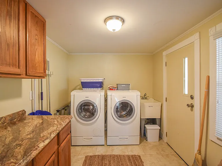 Large laundry room is also a mud room