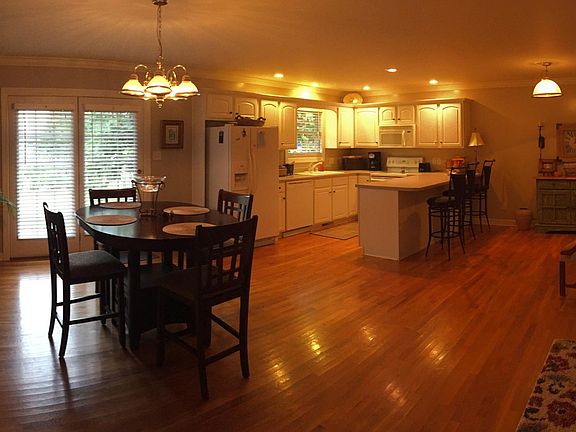 Kitchen/dining area showing breakfast bar and French doors