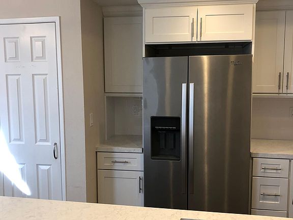 Includes stainless steel refrigerator with ice maker and water dispenser built-in