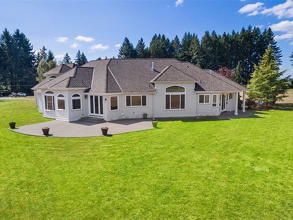 Backyard enjoys entertainment sized patio.