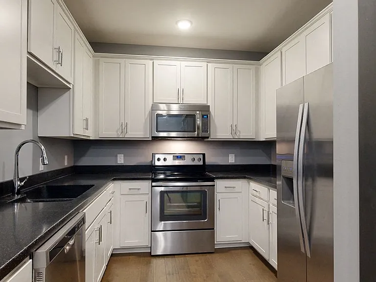 Spacious kitchens feature sleek cabinetry with tons of storage.