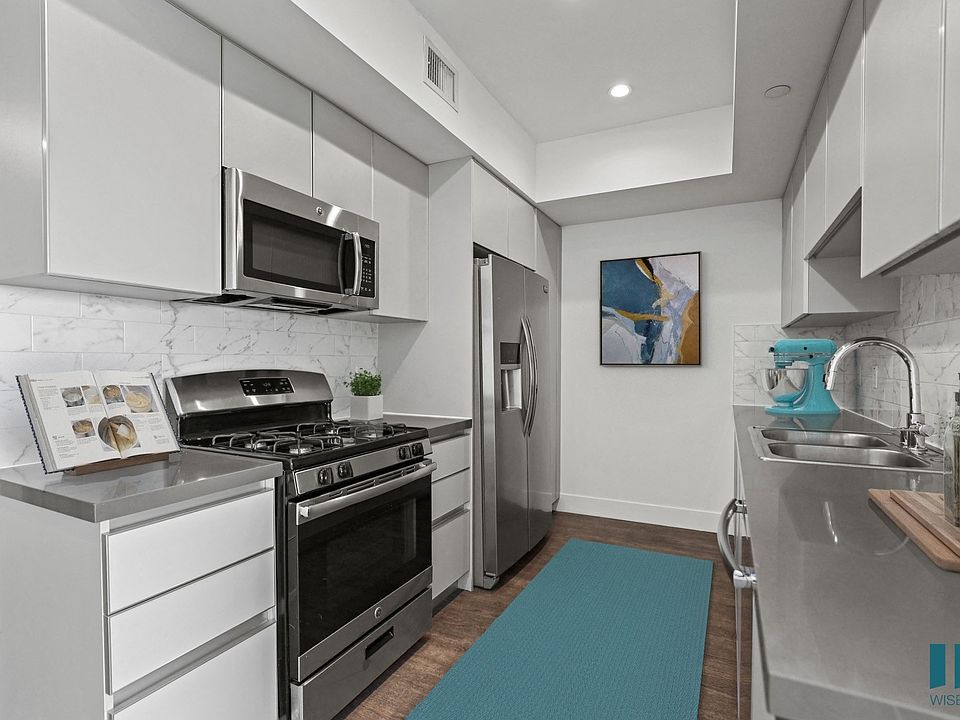 Kitchen with Stainless Refrigerator, Stove, Microwave Oven, and Dishwasher