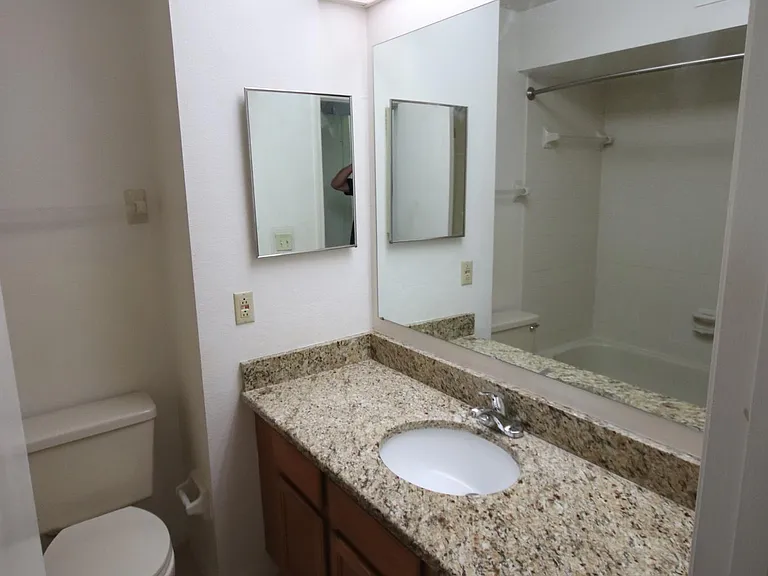 Front Bedroom on-suite full bath with large granite countertop.