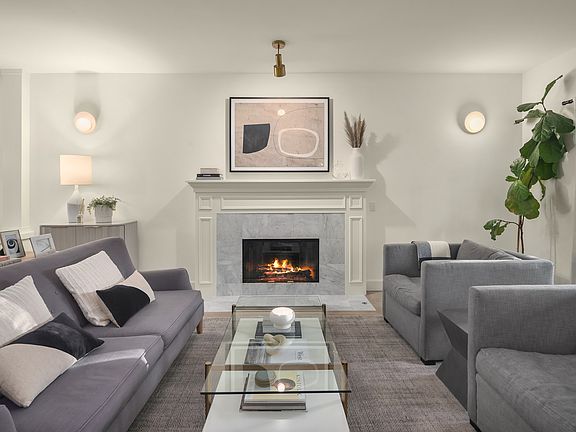 Main living room/gas or wood fireplace/marble surround.