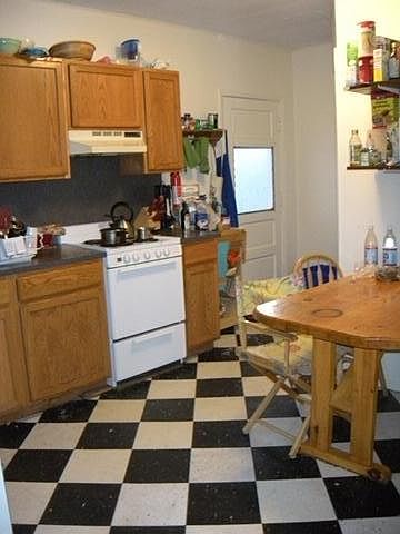 Kitchen w/built in table and access to rear yard