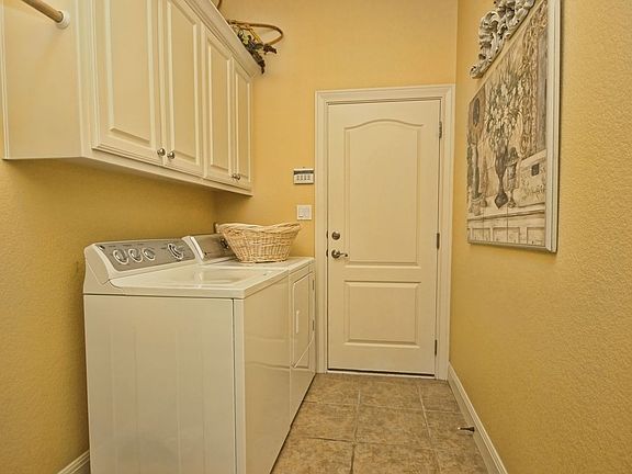 Main floor large laundry/mud room.