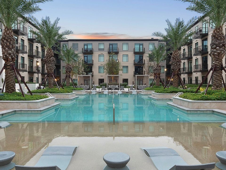 Resort-inspired pool with poolside cabanas and in-pool loungers.