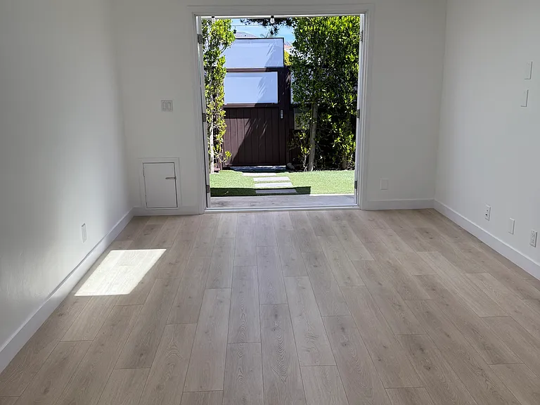 Great room looking towards French doors and your private yard. Brand new light floors